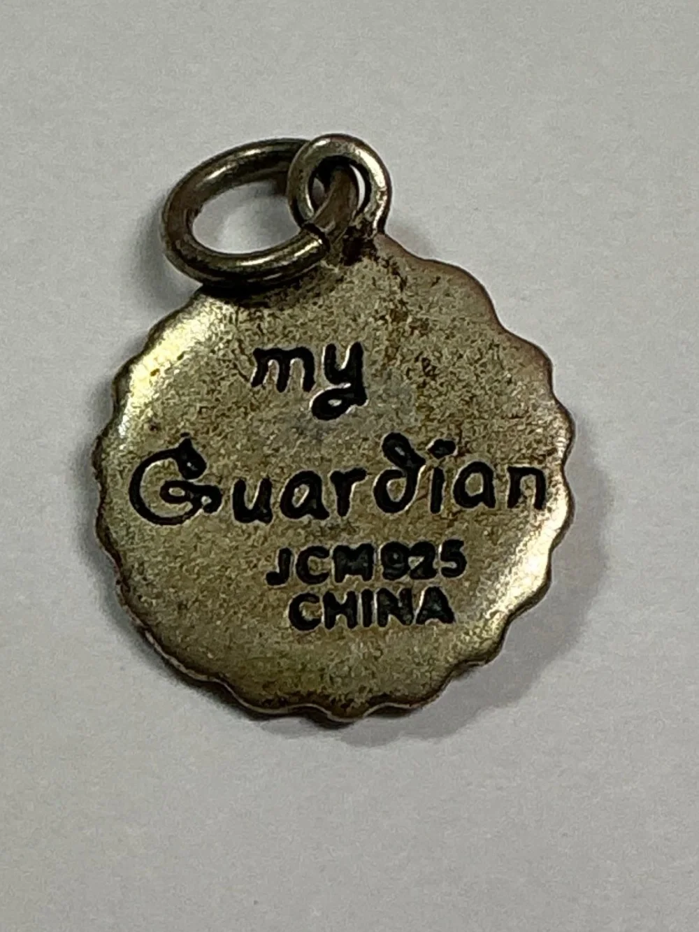Vintage Sterling Silver JCM Guarding Angel Pendant. 1/2 inch diameter